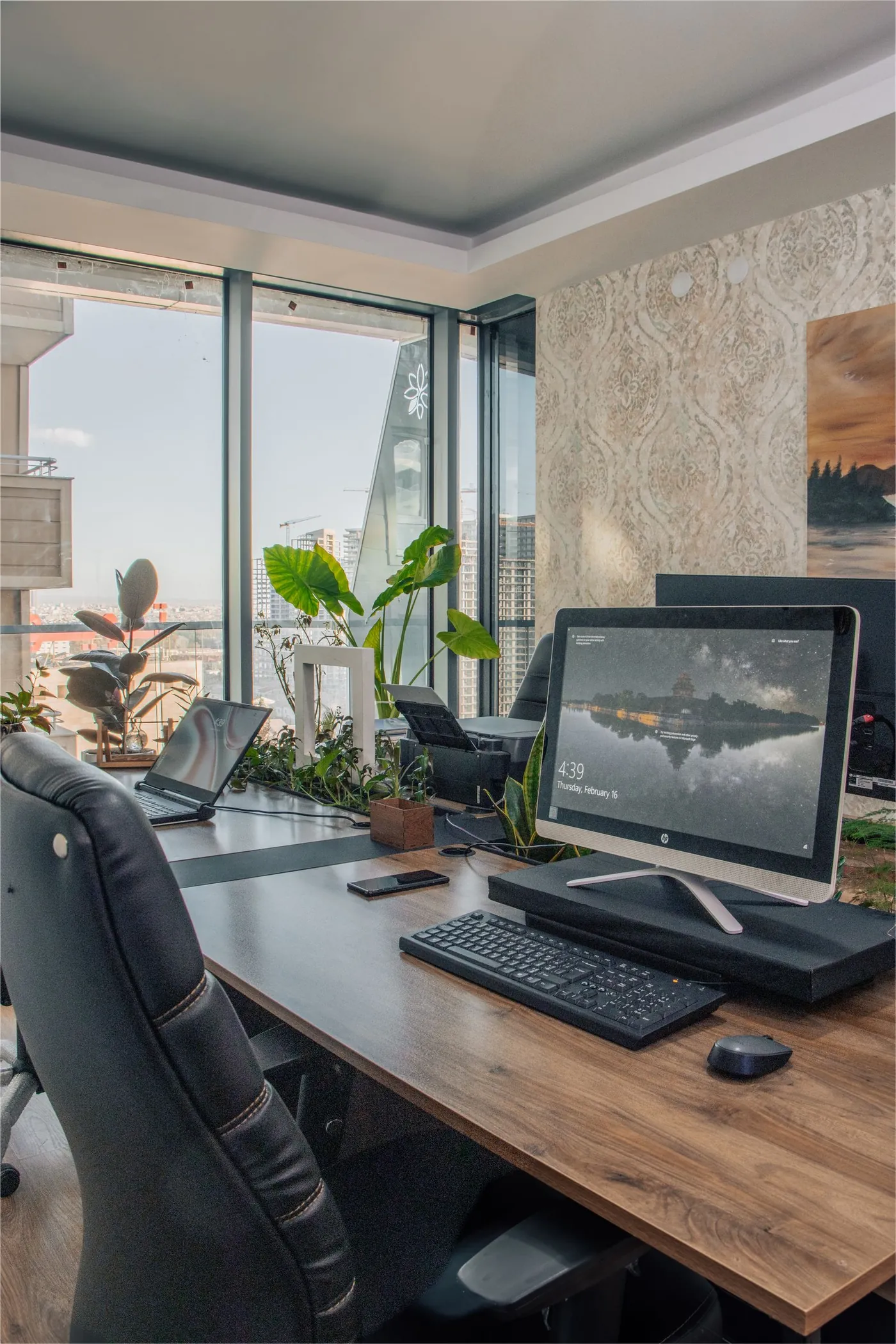 Modern office workspace beside large windows.